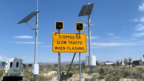 Solar powered slow traffic traffic sign in a remote location