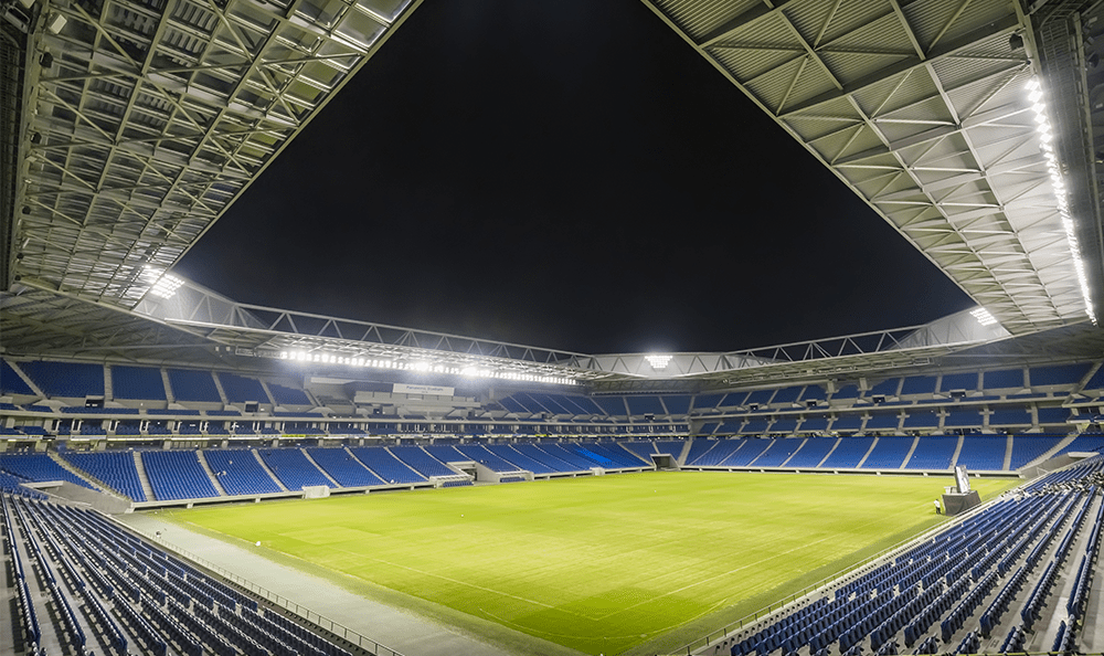 Large empty stadium at night with light control