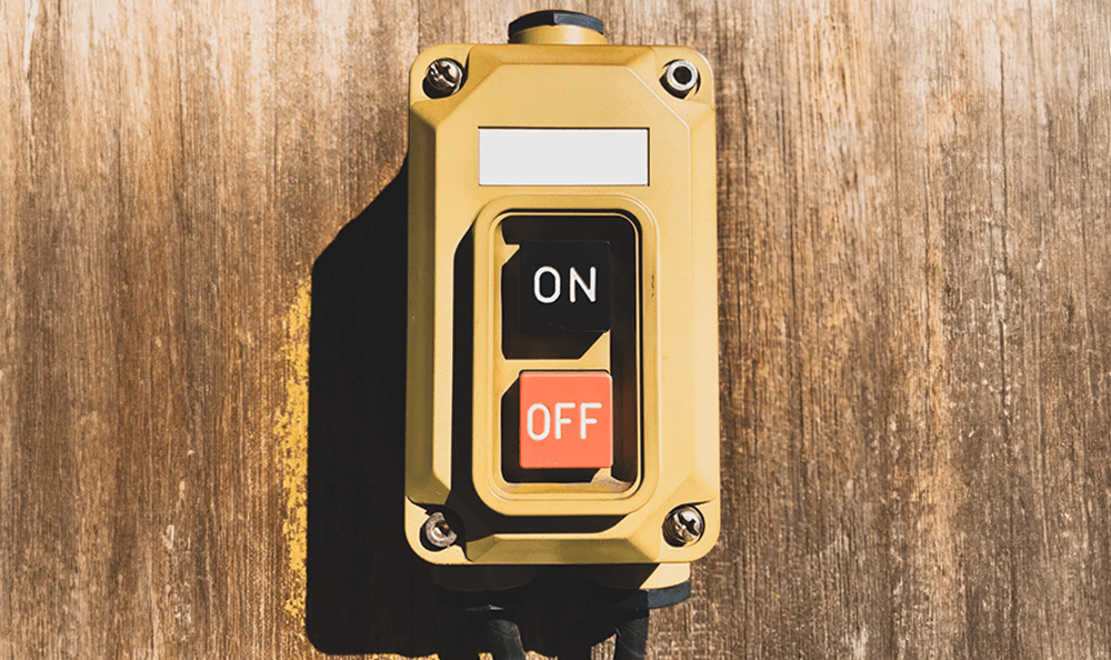 On/Off button mounted to a wood wall