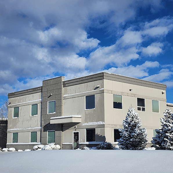 Photograph of the ControlByWeb office building; snowy day with mostly cloudy skies.